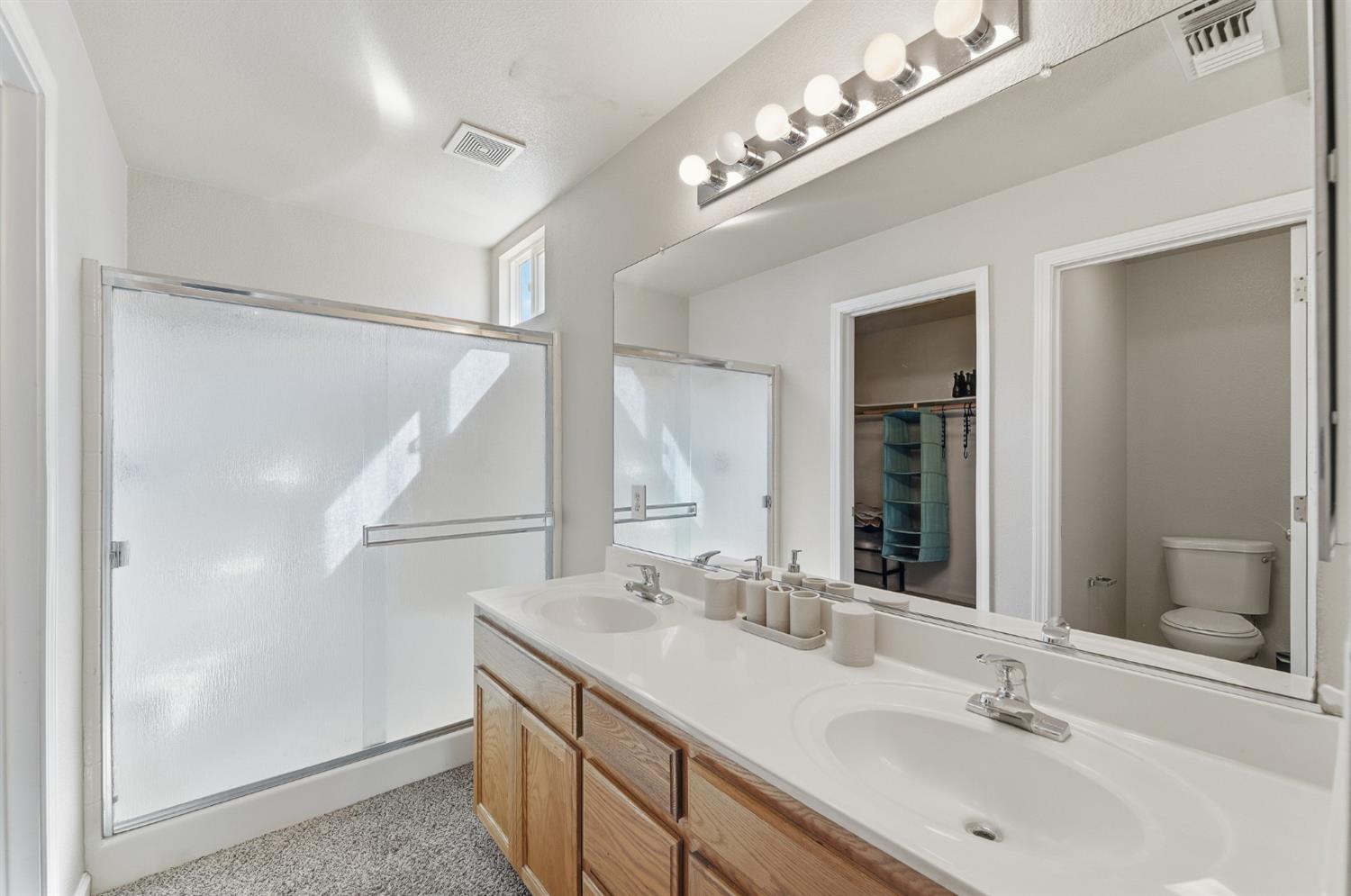 1933 Lifetime Drive Modesto, CA 95355 - Photo 23 of 38 a bathroom with a sink double vanity and a mirror