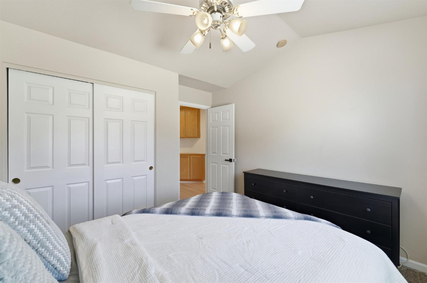 1933 Lifetime Drive Modesto, CA 95355 - Photo 26 of 38 a bedroom with a bed and a chandelier