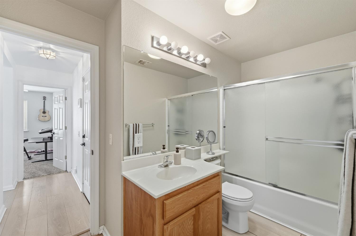 1933 Lifetime Drive Modesto, CA 95355 - Photo 27 of 38 a bathroom with a sink a toilet and shower