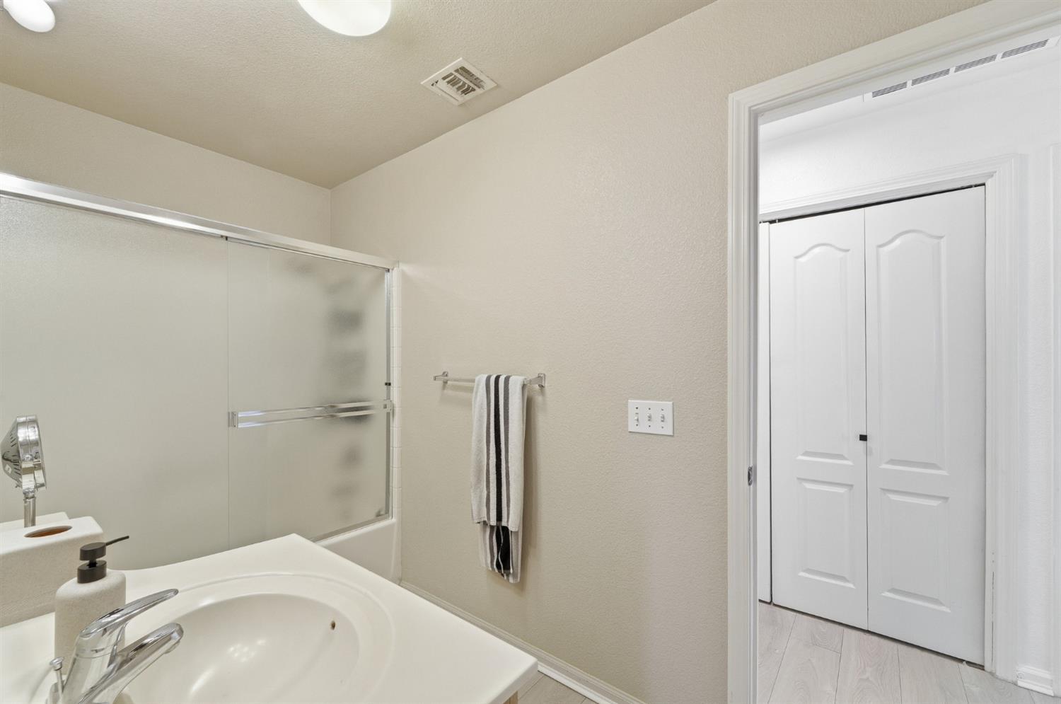 1933 Lifetime Drive Modesto, CA 95355 - Photo 29 of 38 a bathroom with a tub and shower