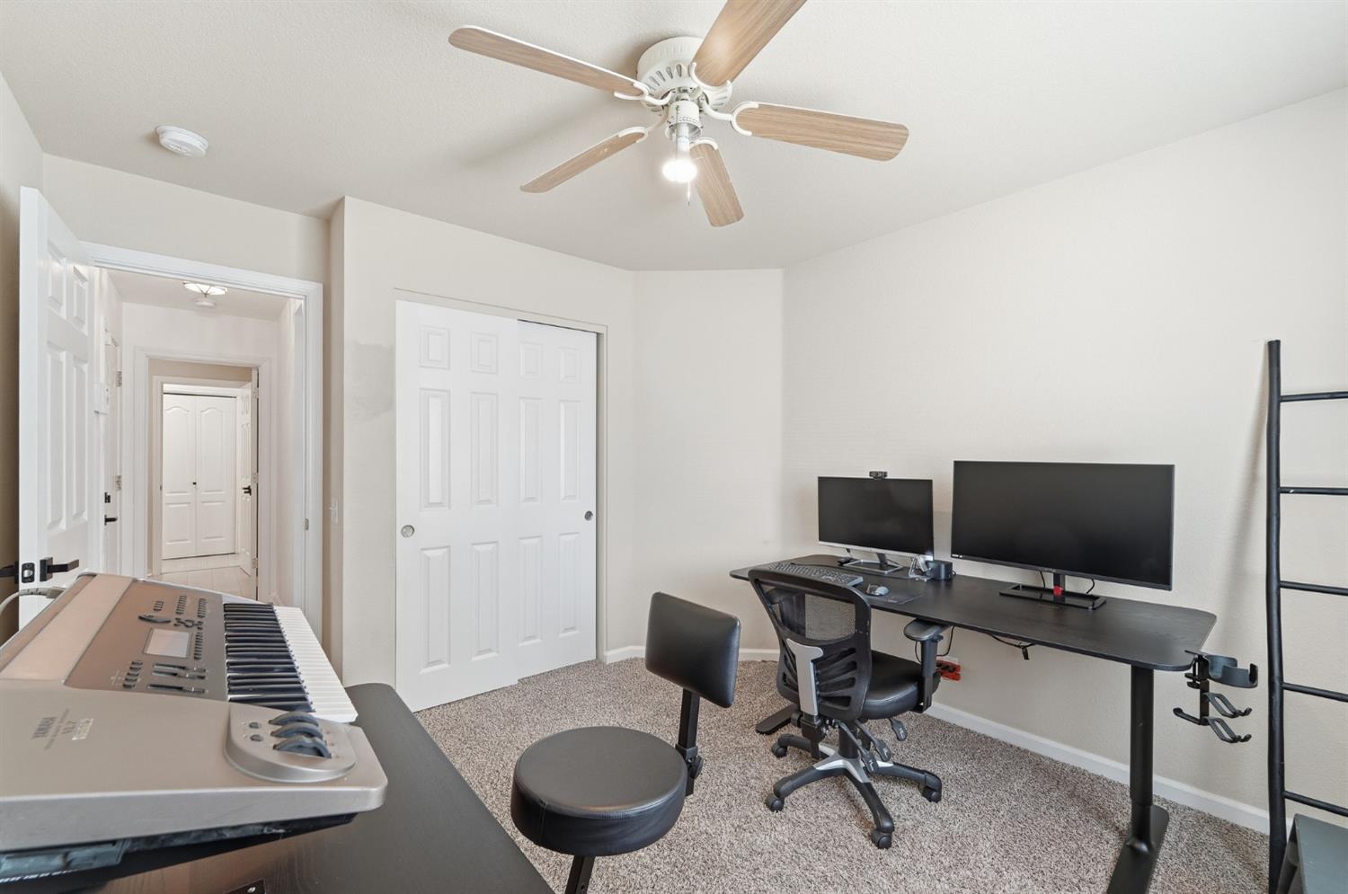 1933 Lifetime Drive Modesto, CA 95355 - Photo 31 of 38 a view of a workspace with furniture and a bathroom