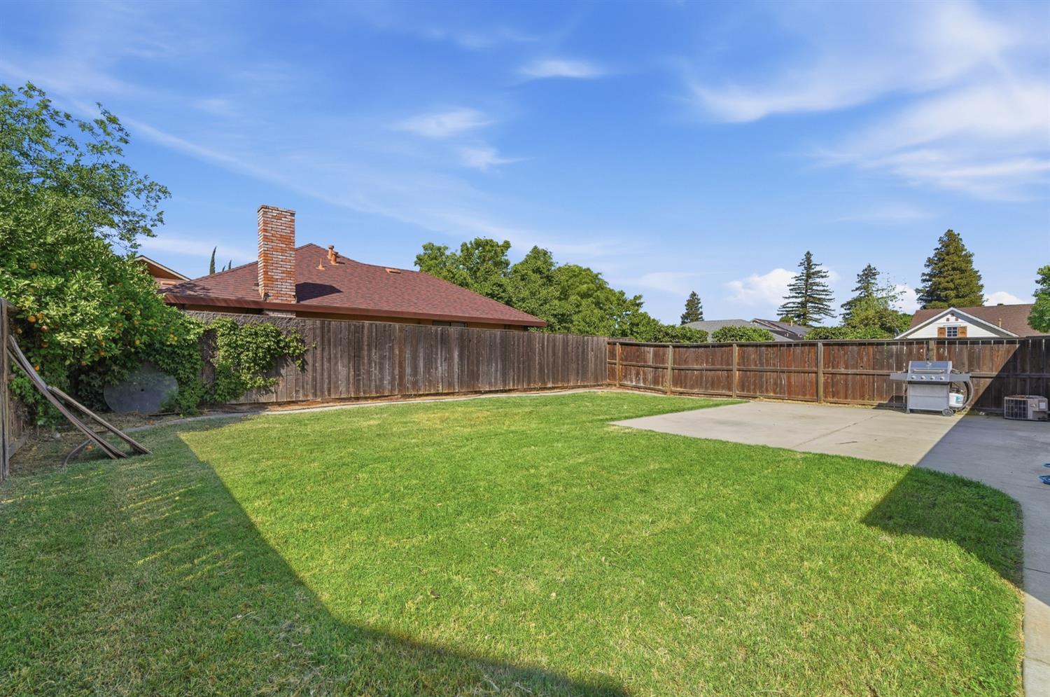 1933 Lifetime Drive Modesto, CA 95355 - Photo 37 of 38 a view of a backyard with a garden and entertaining space