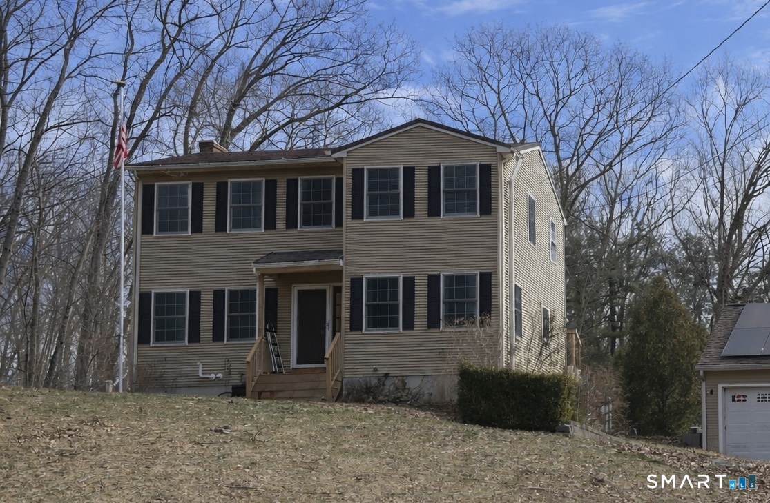 79 All Hallows Road Plainfield, CT 06239 - Photo 1 of 5 a front view of a house with a garden