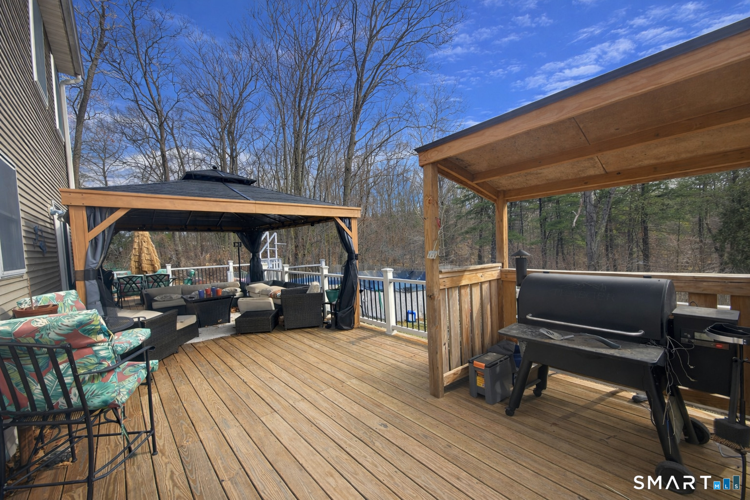 79 All Hallows Road Plainfield, CT 06239 - Photo 4 of 5 a view of a patio with table and chairs barbeque with wooden floor and fence