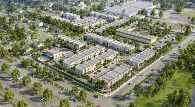 an aerial view of residential houses with yard