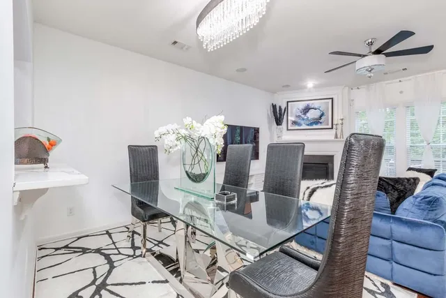 a dining room with furniture and wooden floor