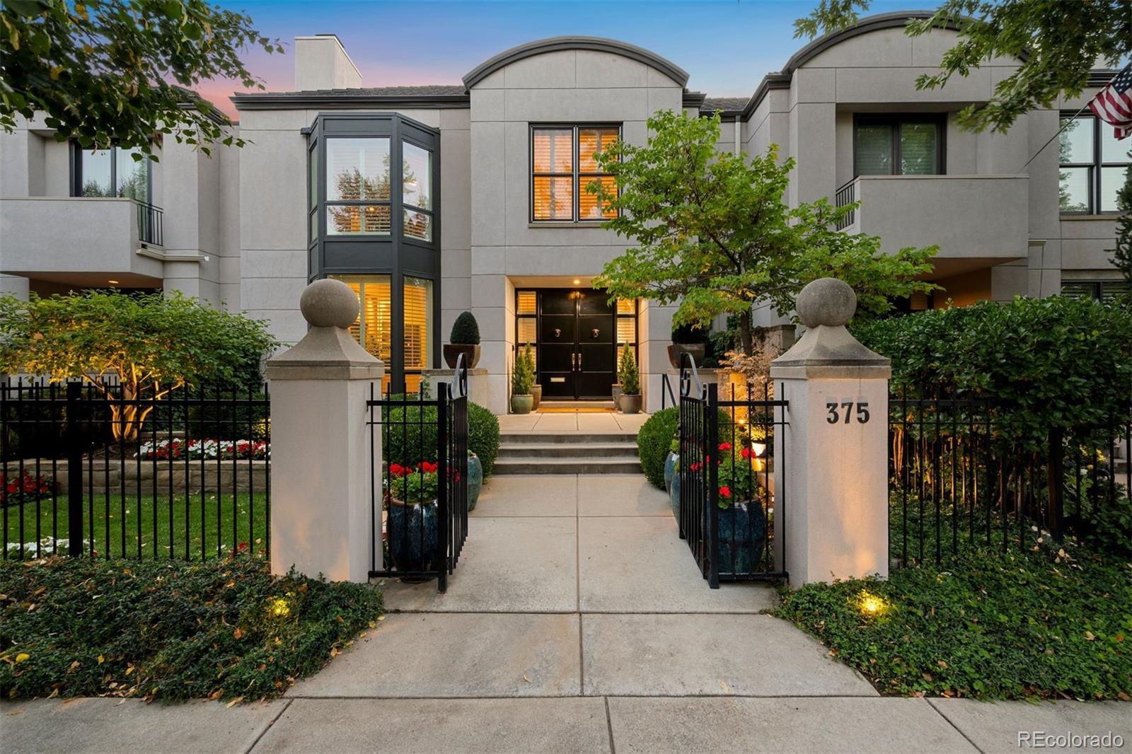 375 Clayton Street Denver, CO 80206 - Photo 1 of 45 a front view of a house with a garden