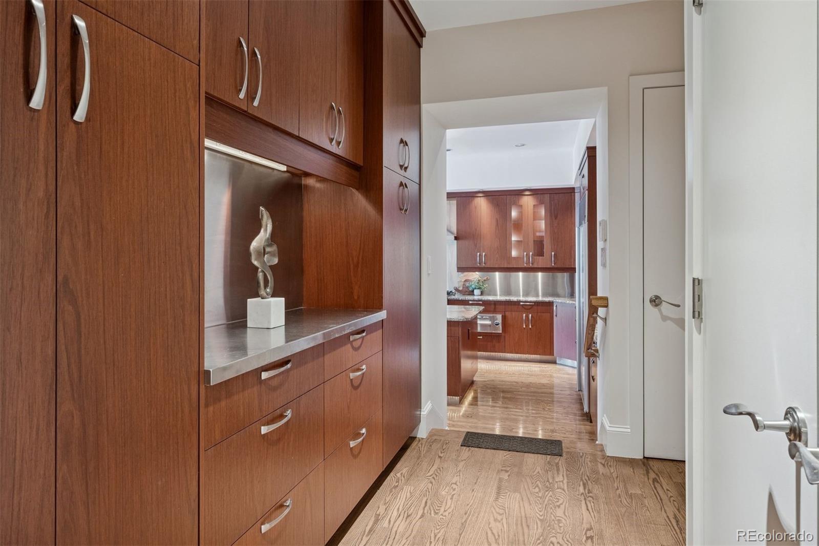 375 Clayton Street Denver, CO 80206 - Photo 11 of 45 a view of hallway with living room and wooden floor