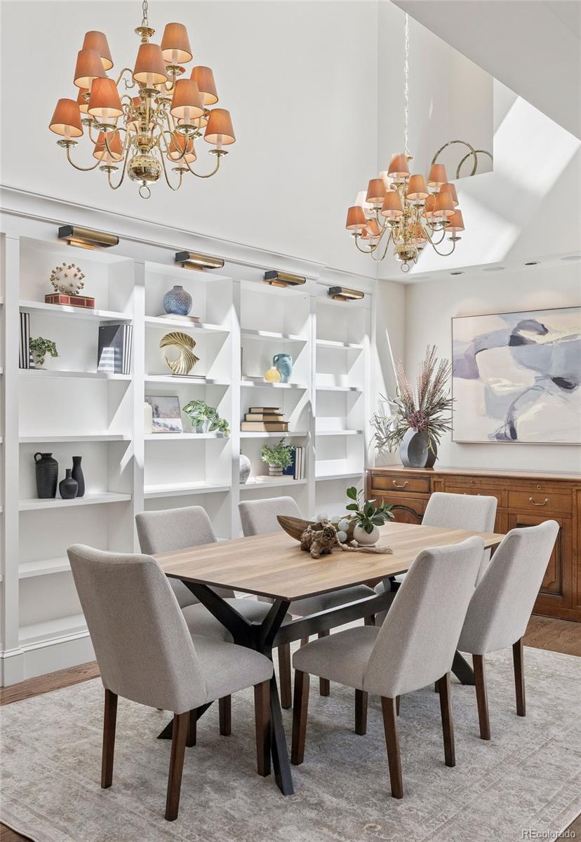 375 Clayton Street Denver, CO 80206 - Photo 12 of 45 a view of a dining room with furniture and chandelier