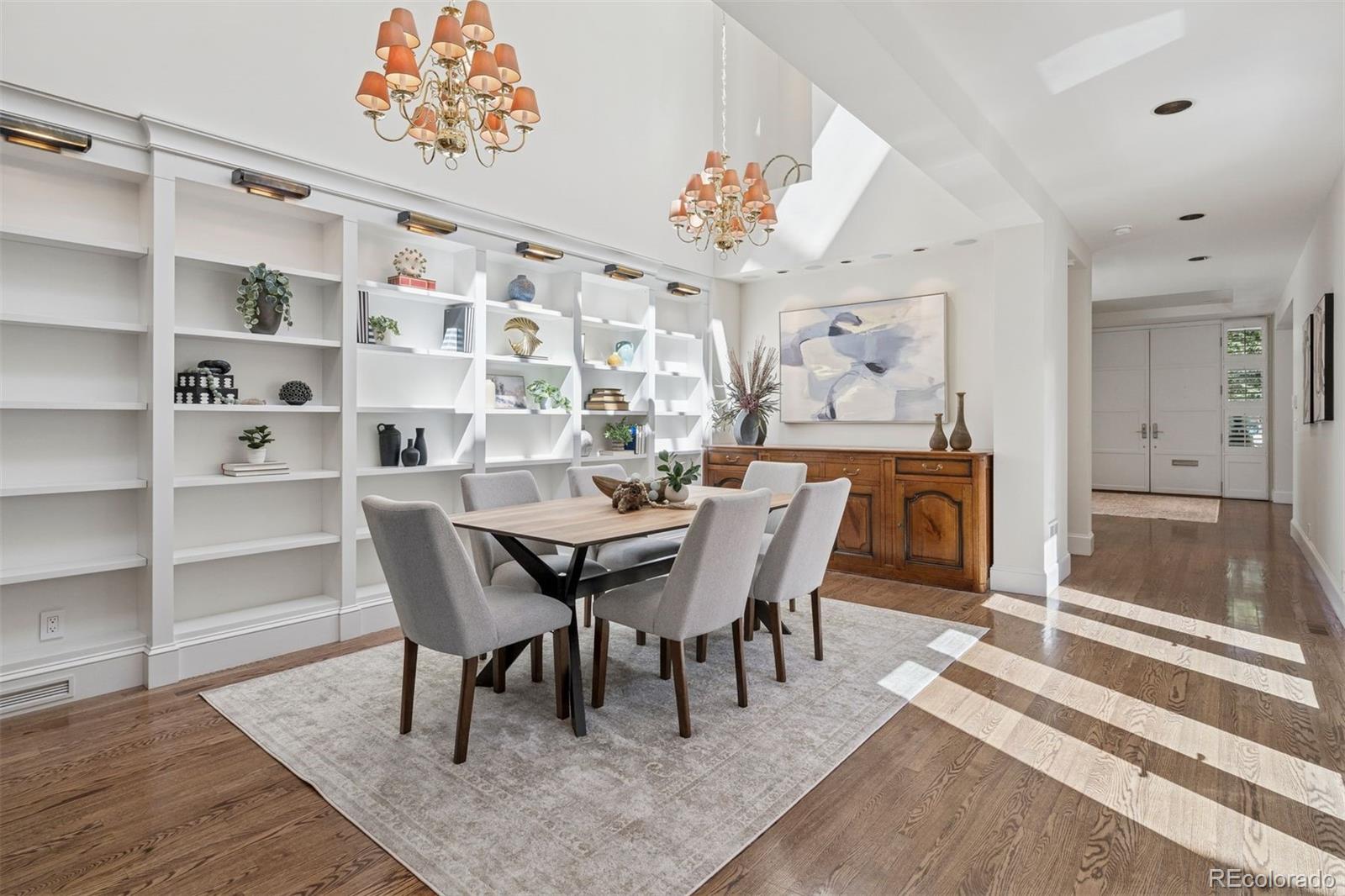 375 Clayton Street Denver, CO 80206 - Photo 13 of 45 a view of a dining room with furniture and wooden floor