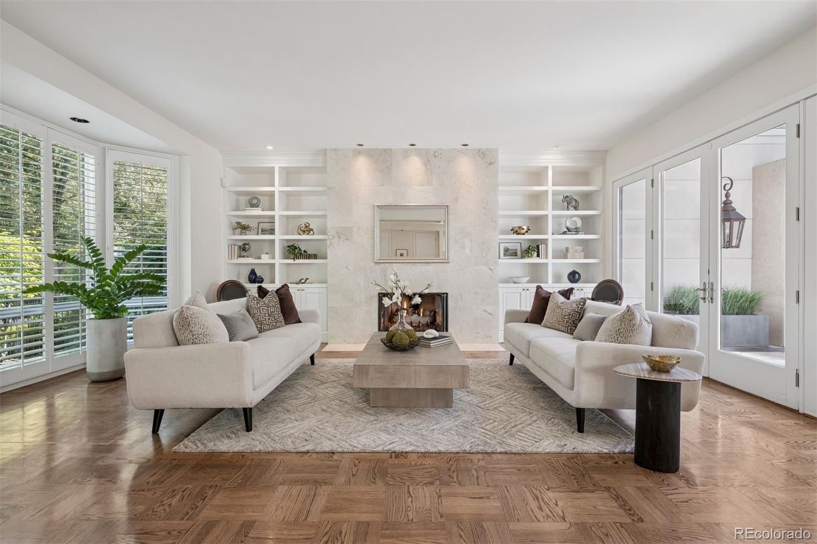 375 Clayton Street Denver, CO 80206 - Photo 17 of 45 a living room with furniture and a large window