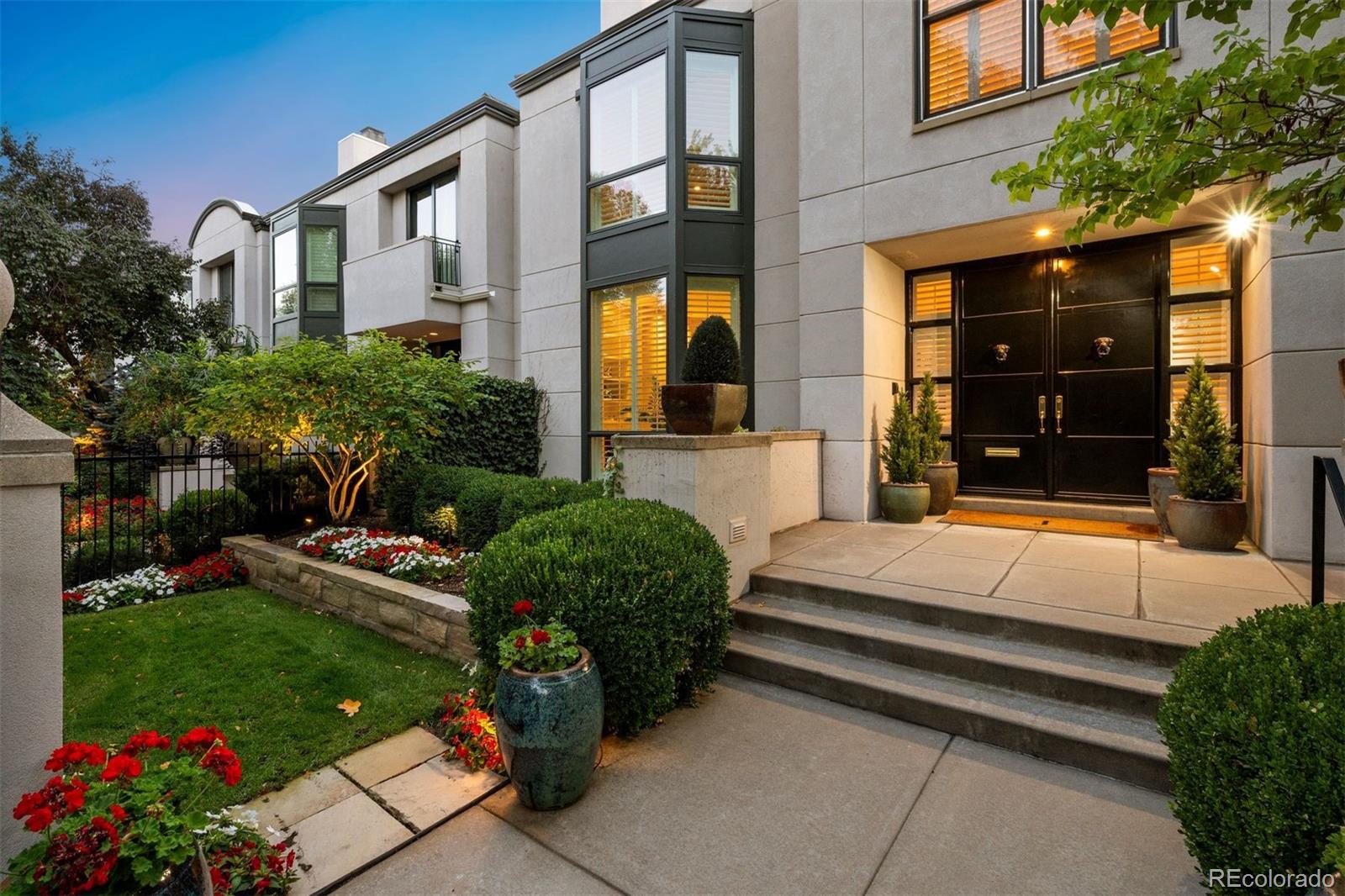 375 Clayton Street Denver, CO 80206 - Photo 2 of 45 a front view of a house with a garden