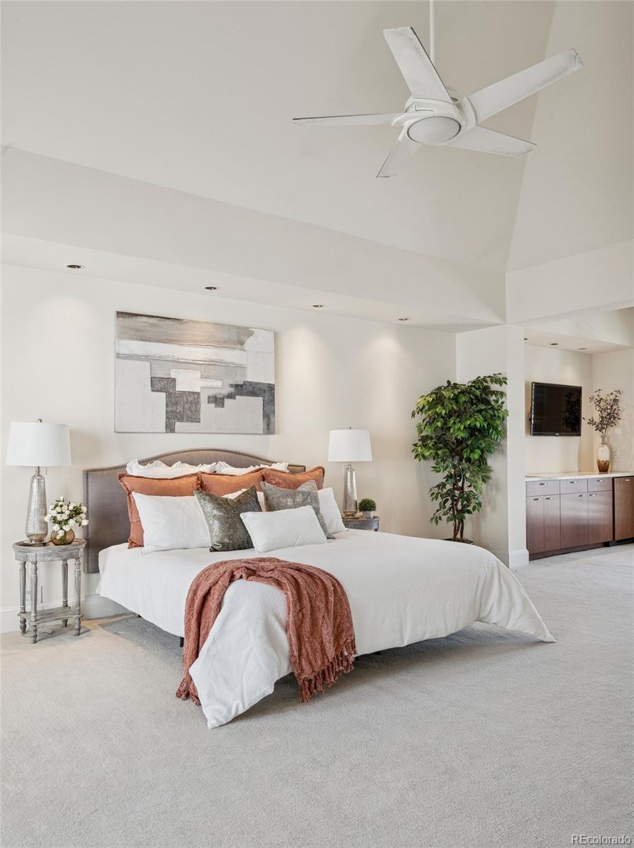 375 Clayton Street Denver, CO 80206 - Photo 25 of 45 a bedroom with a bed and a couch