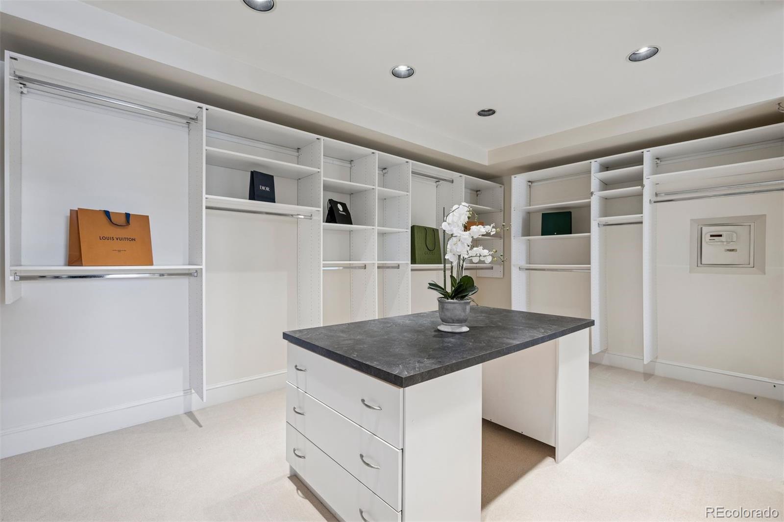 375 Clayton Street Denver, CO 80206 - Photo 27 of 45 a kitchen with stainless steel appliances granite countertop a sink and a refrigerator