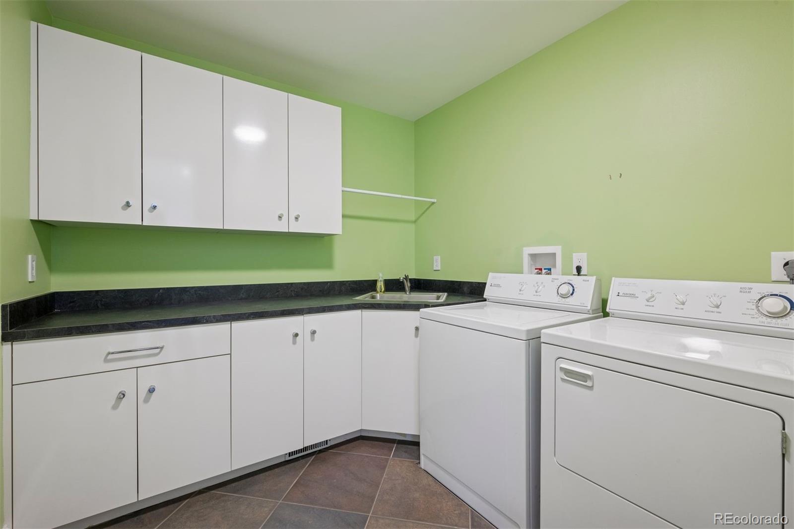 375 Clayton Street Denver, CO 80206 - Photo 30 of 45 a utility room with dryer and washer