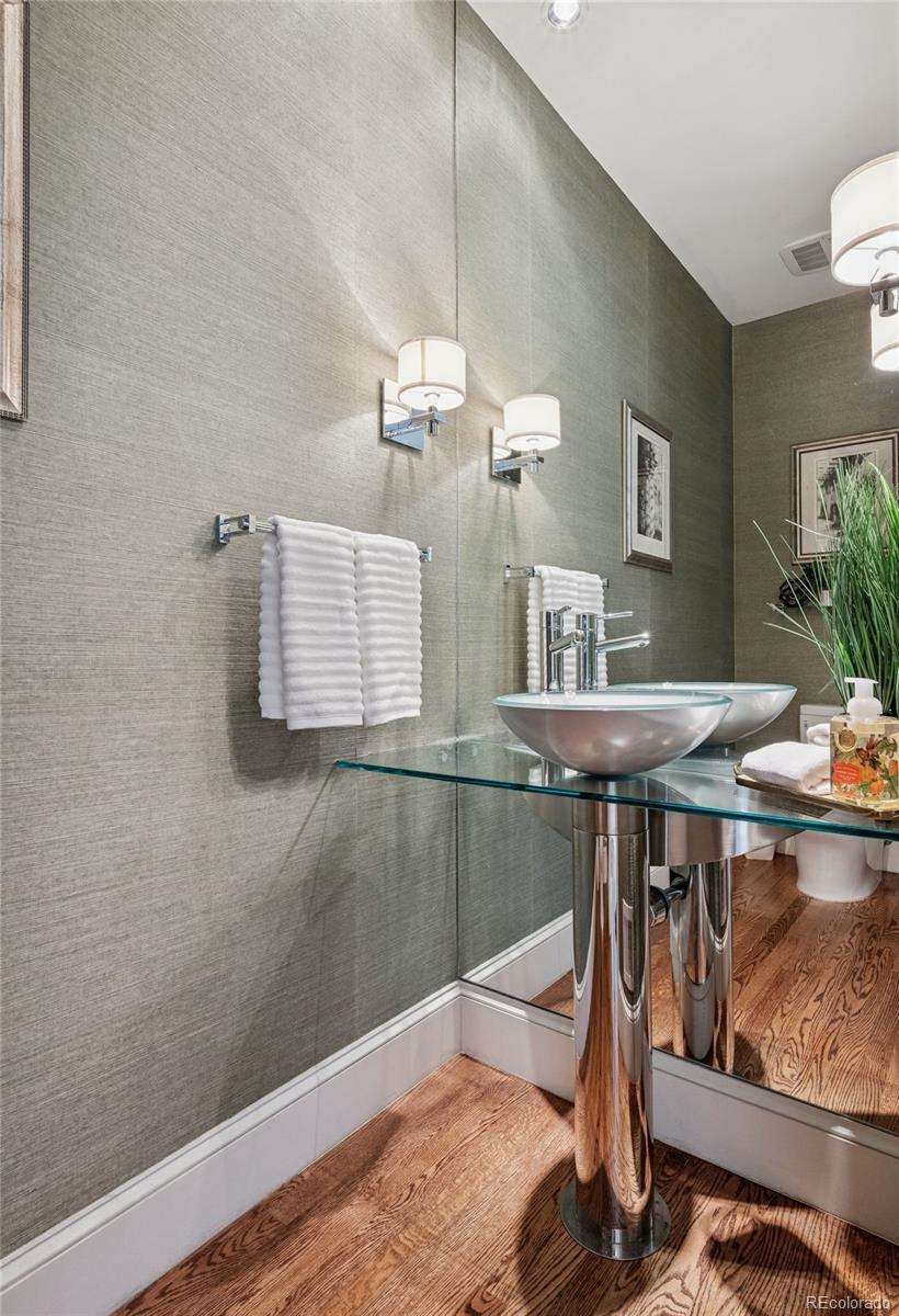 375 Clayton Street Denver, CO 80206 - Photo 31 of 45 a dining room with table chairs and chandelier