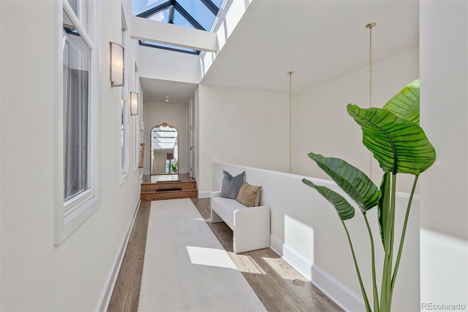 375 Clayton Street Denver, CO 80206 - Photo 35 of 45 a living room with furniture and a rug