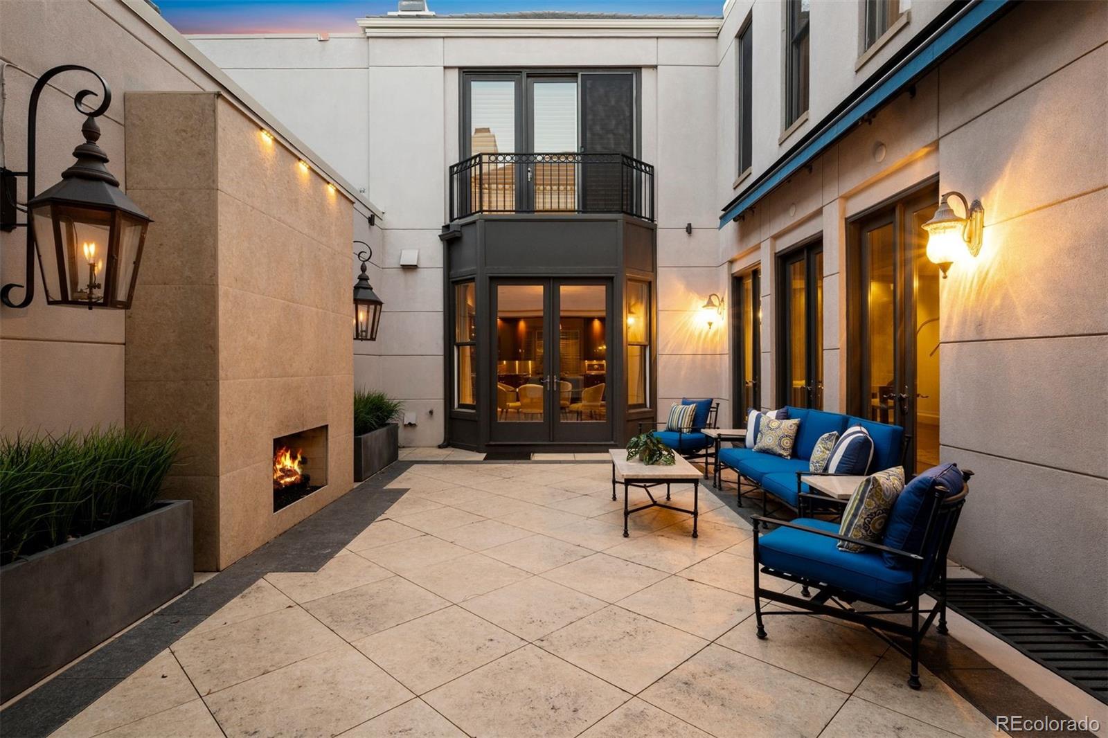 375 Clayton Street Denver, CO 80206 - Photo 42 of 45 a building outdoor space with patio furniture and potted plants