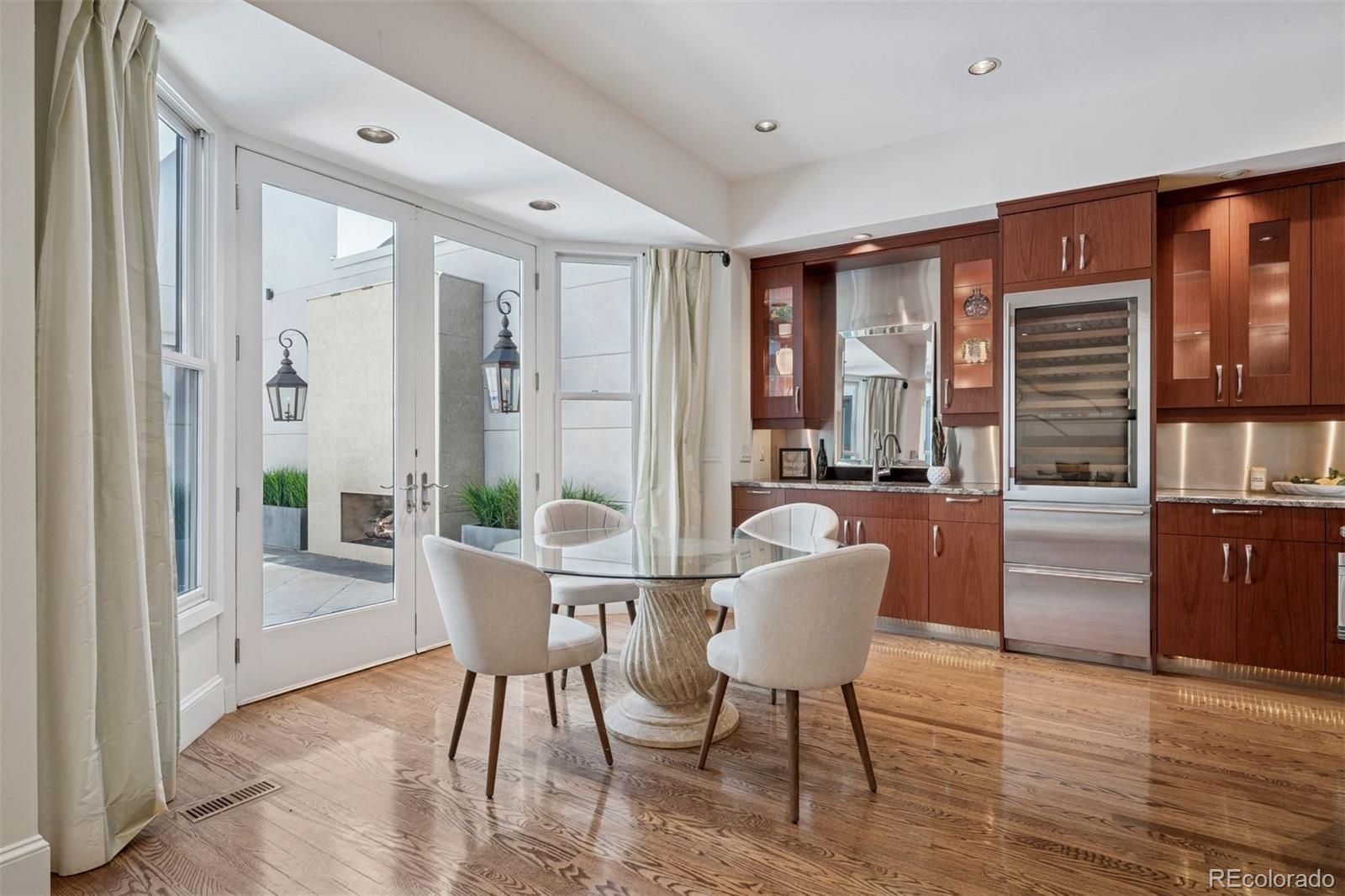 375 Clayton Street Denver, CO 80206 - Photo 6 of 45 a living room with furniture and a window