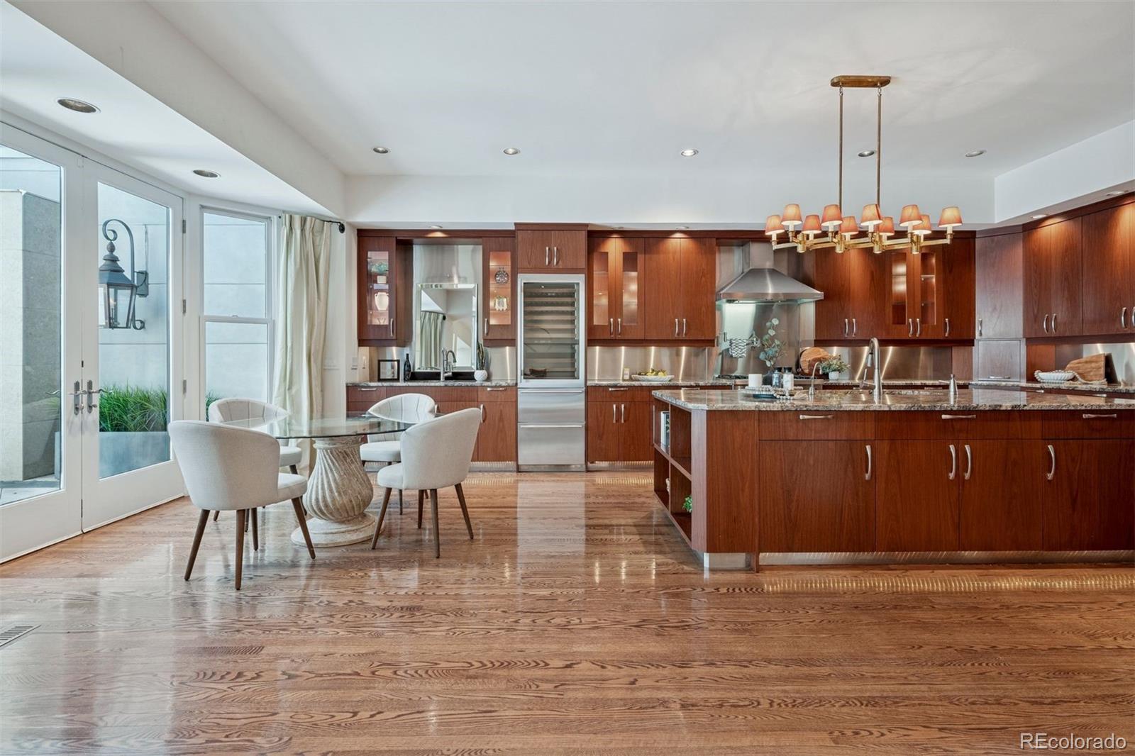 375 Clayton Street Denver, CO 80206 - Photo 7 of 45 a living room with lots of furniture and kitchen view