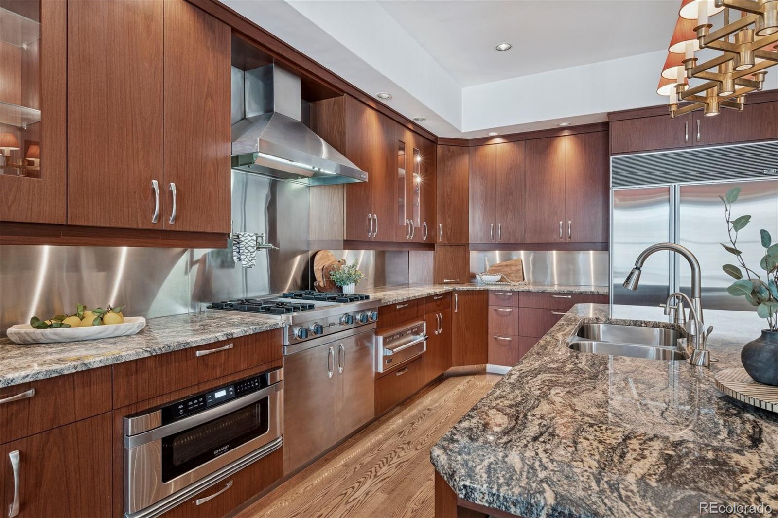 375 Clayton Street Denver, CO 80206 - Photo 10 of 45 a kitchen with a stove and a sink