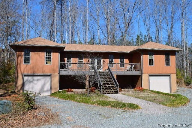 Workshop - 2000 square foot wood-working shop with exhaust vents installed. Wood storage racks below, rear loading dock. Beautiful hardwood floors. Potential guest house.