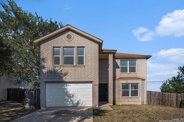 a front view of a house with yard