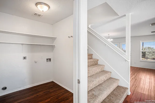 a view of entryway with wooden floor