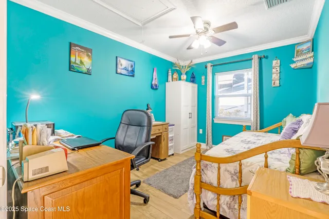 a bedroom with a bed and a workspace