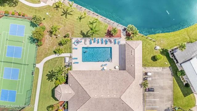 an aerial view of a house with a lake view
