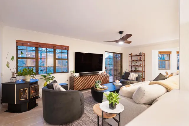 a kitchen with stainless steel appliances kitchen island granite countertop a sink and cabinets