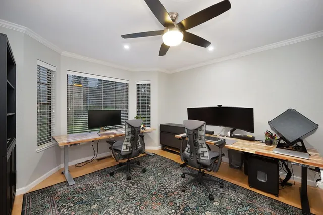 a spacious bathroom with a granite countertop sink a toilet and a mirror