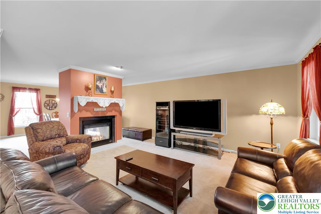 3830 McIntosh Drive Orefield, PA 18069 - Photo 7 of 36 a living room with furniture and a flat screen tv