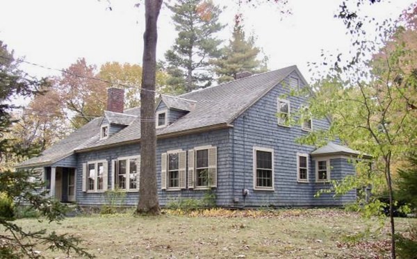 49 Garrison Road Hingham, MA 02043 - Photo 1 of 3 a front view of a house with garden