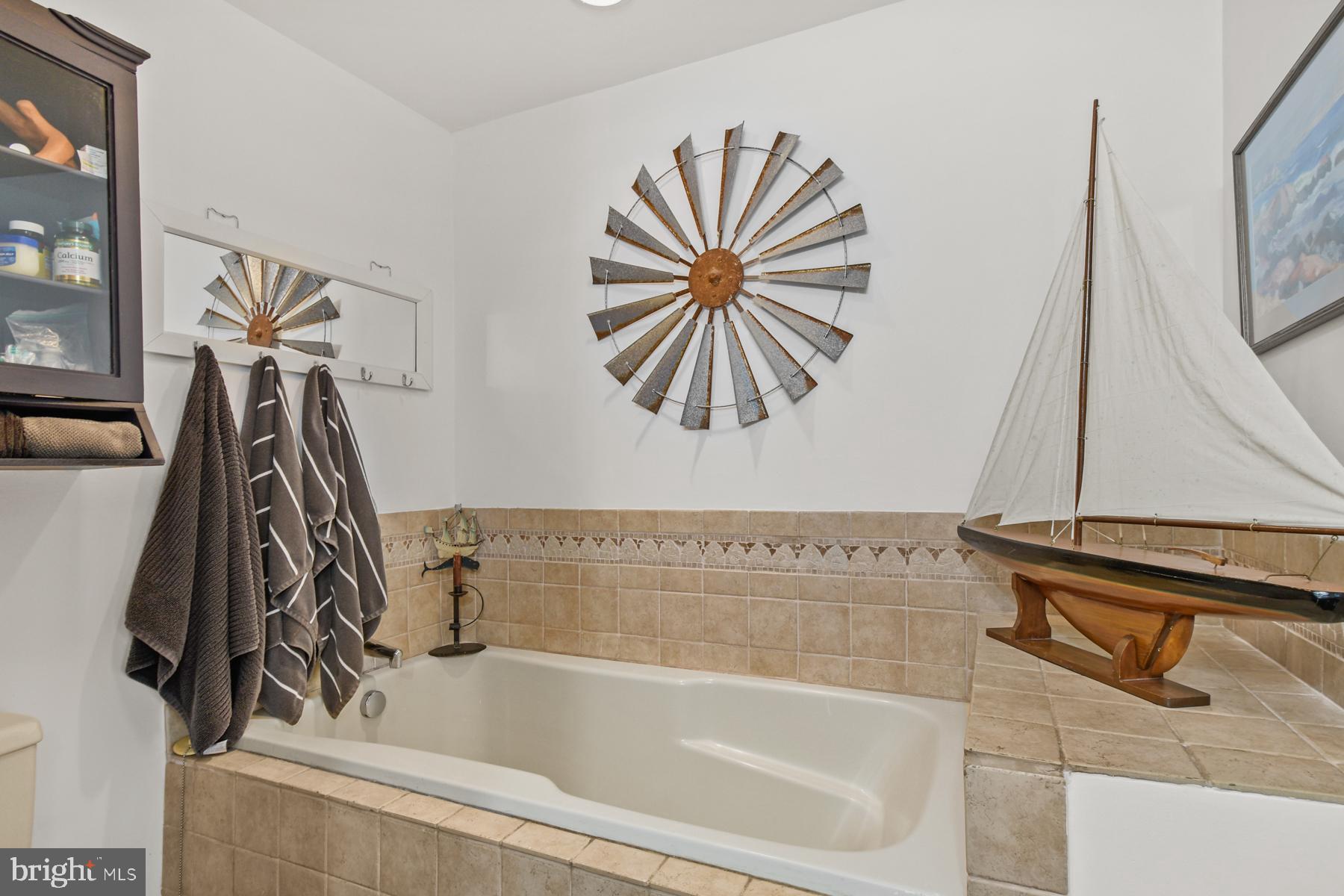 103 Buckingham Road Berlin, MD 21811 - Photo 34 of 62 a bathroom with a bathtub and a shower