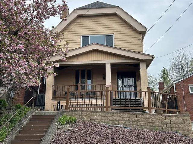 a front view of a house with a porch