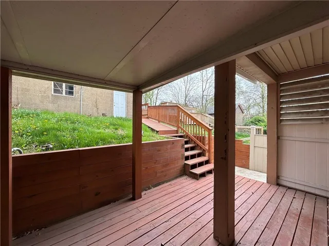a view of balcony with wooden floor