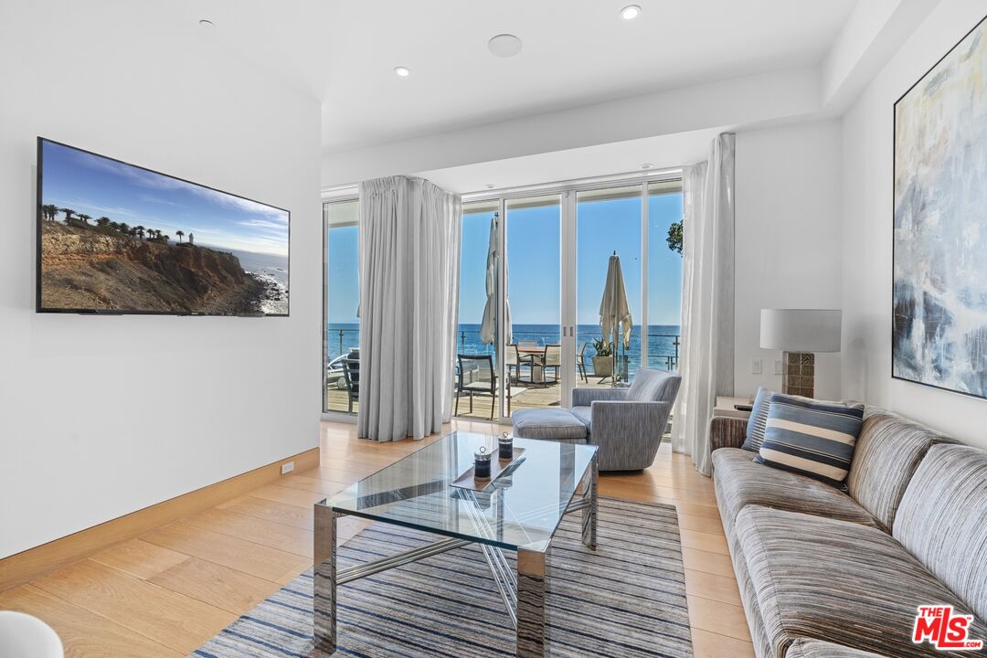 24380 Malibu Road Malibu, CA 90265 - Photo 14 of 48 a living room with furniture and a large window