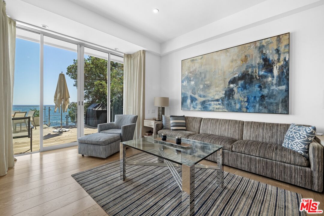 24380 Malibu Road Malibu, CA 90265 - Photo 16 of 50 a living room with furniture and a large window