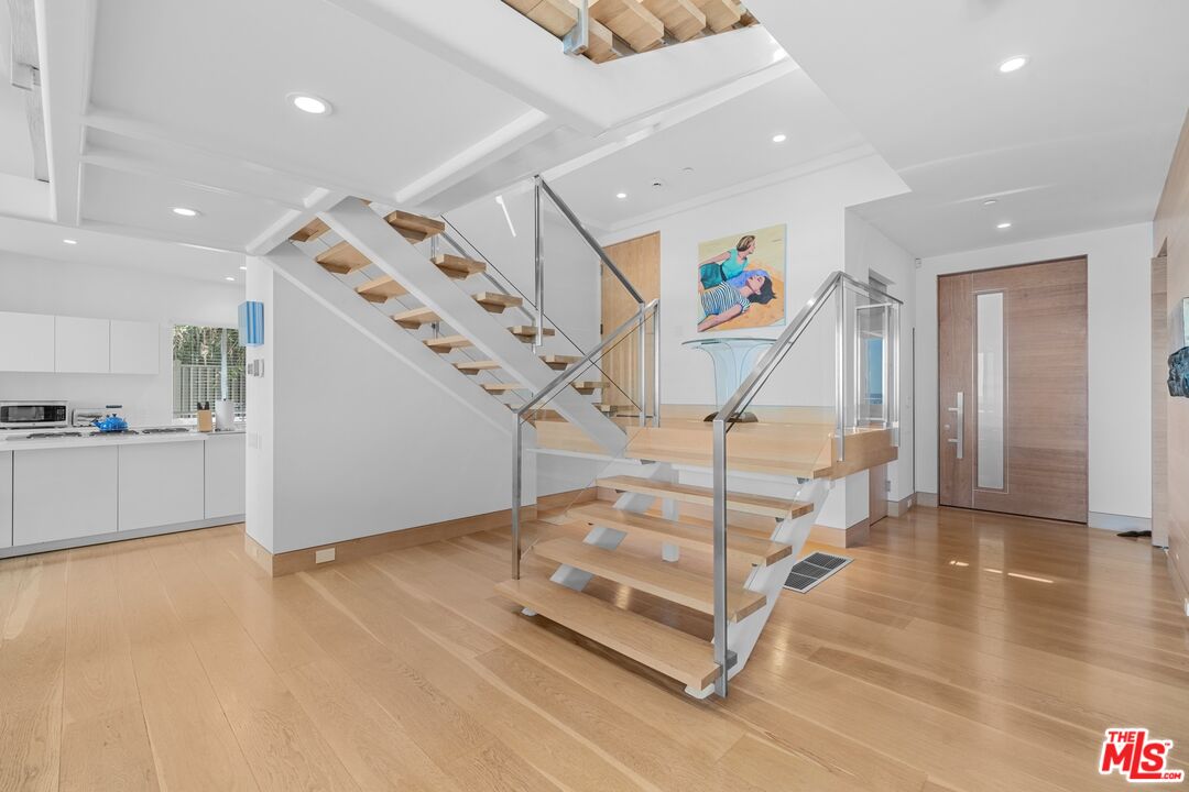 24380 Malibu Road Malibu, CA 90265 - Photo 21 of 48 a room with lots of white furniture and entryway
