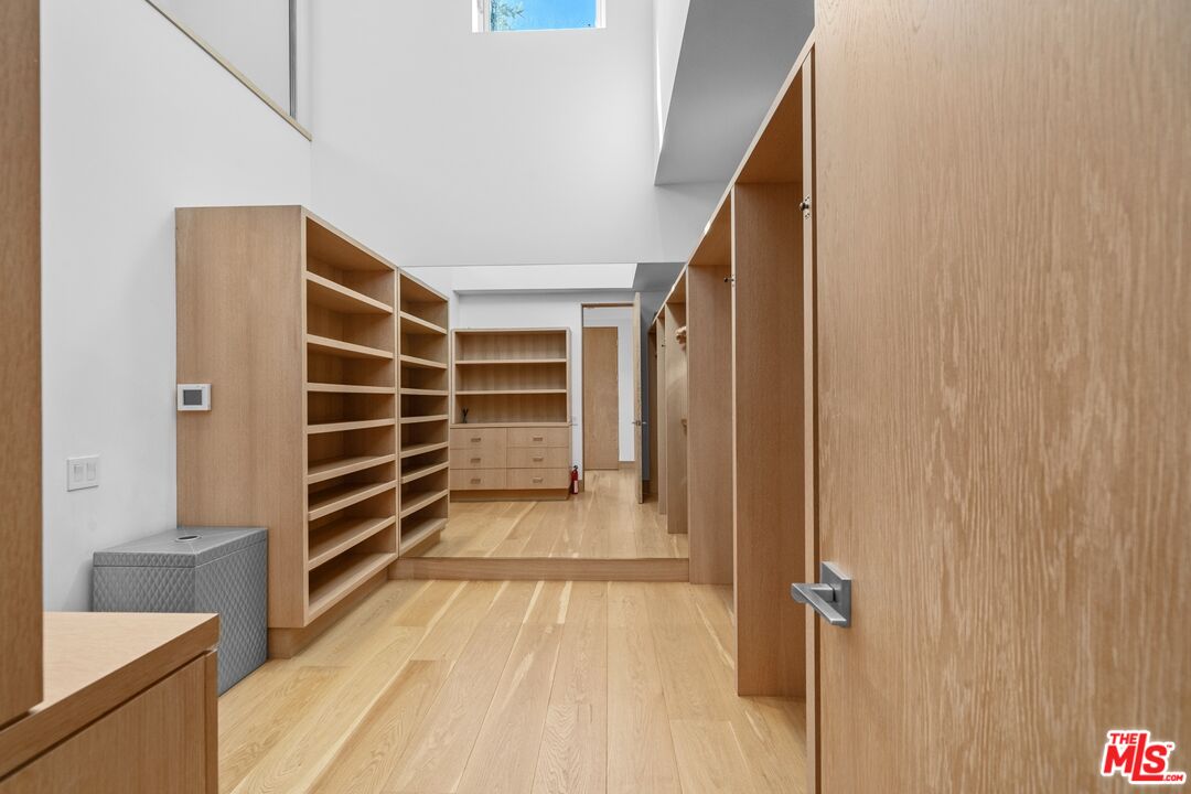 24380 Malibu Road Malibu, CA 90265 - Photo 26 of 48 a view of walk in closet with empty racks