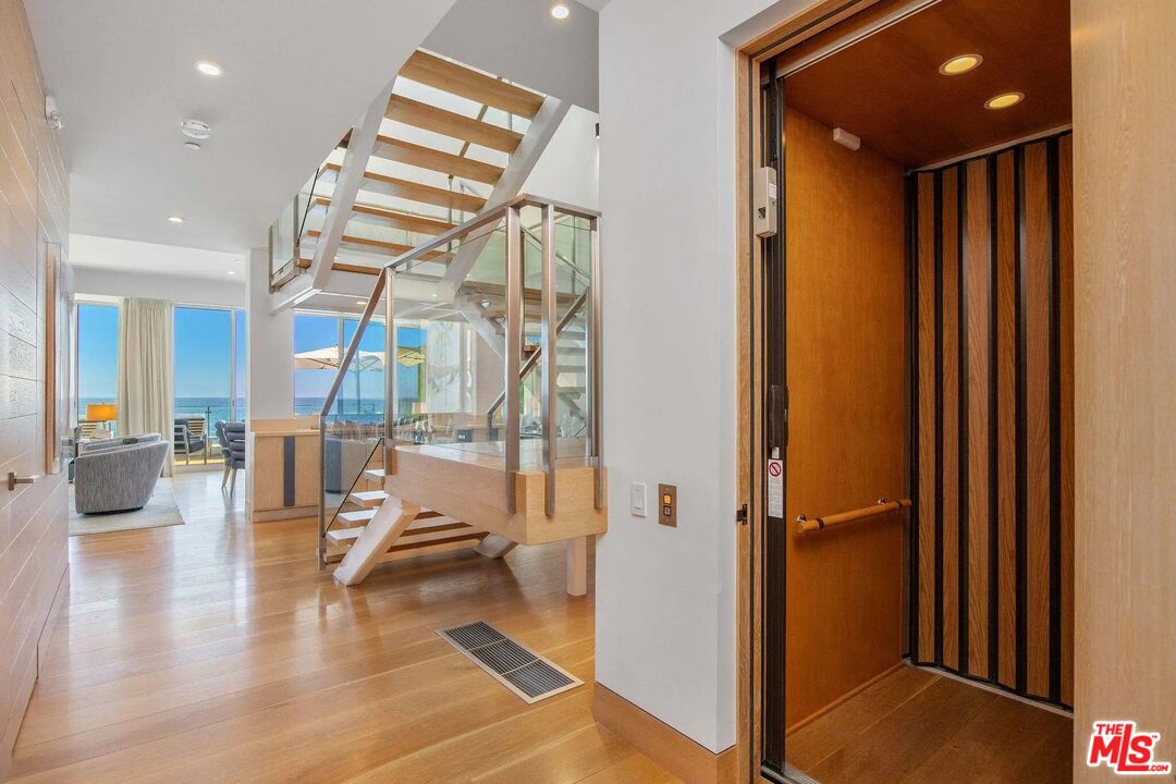 24380 Malibu Road Malibu, CA 90265 - Photo 37 of 48 a view of entryway and hall with wooden floor