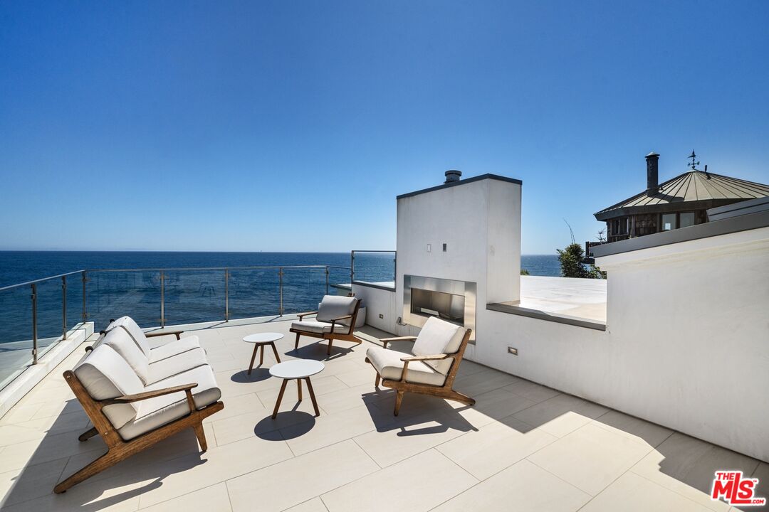 24380 Malibu Road Malibu, CA 90265 - Photo 38 of 48 a view of a terrace with chairs