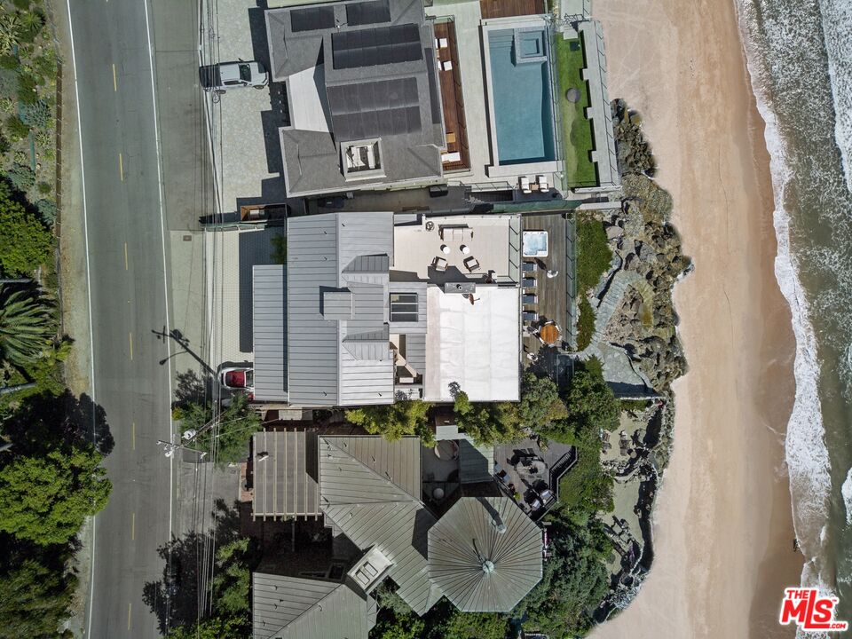 24380 Malibu Road Malibu, CA 90265 - Photo 44 of 48 aerial view of a house with a yard and sitting area