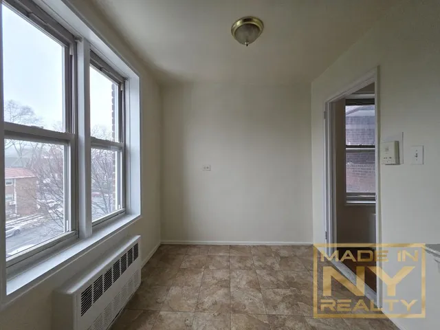 a view of an empty room with windows