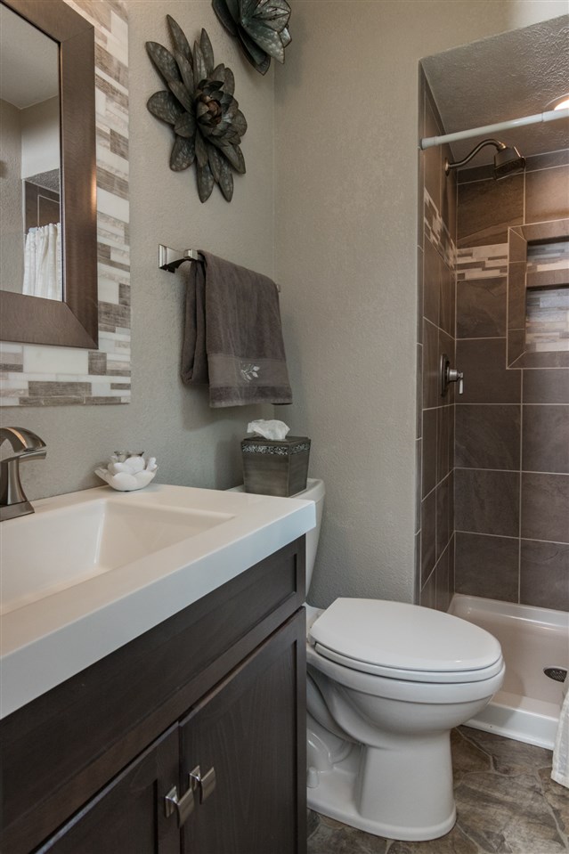 5780 Rural Edge Drive Roscoe, IL 61073 - Photo 13 of 25 a bathroom with a sink a toilet and shower