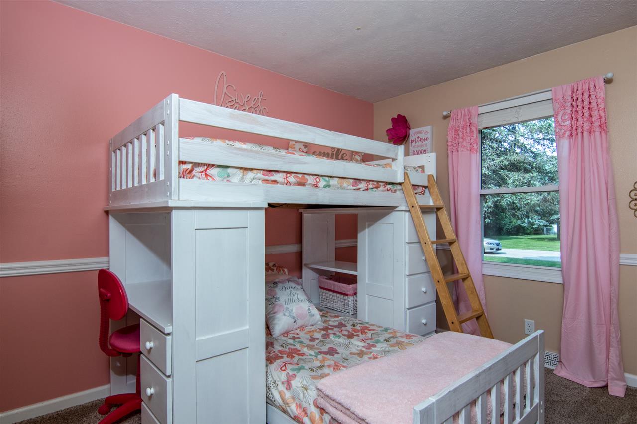 5780 Rural Edge Drive Roscoe, IL 61073 - Photo 15 of 25 a bedroom with a bed and a window