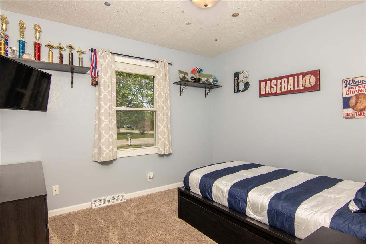 5780 Rural Edge Drive Roscoe, IL 61073 - Photo 17 of 25 a bedroom with bed and a window