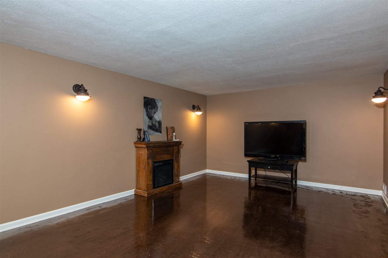 5780 Rural Edge Drive Roscoe, IL 61073 - Photo 22 of 25 a living room with furniture and a flat screen tv