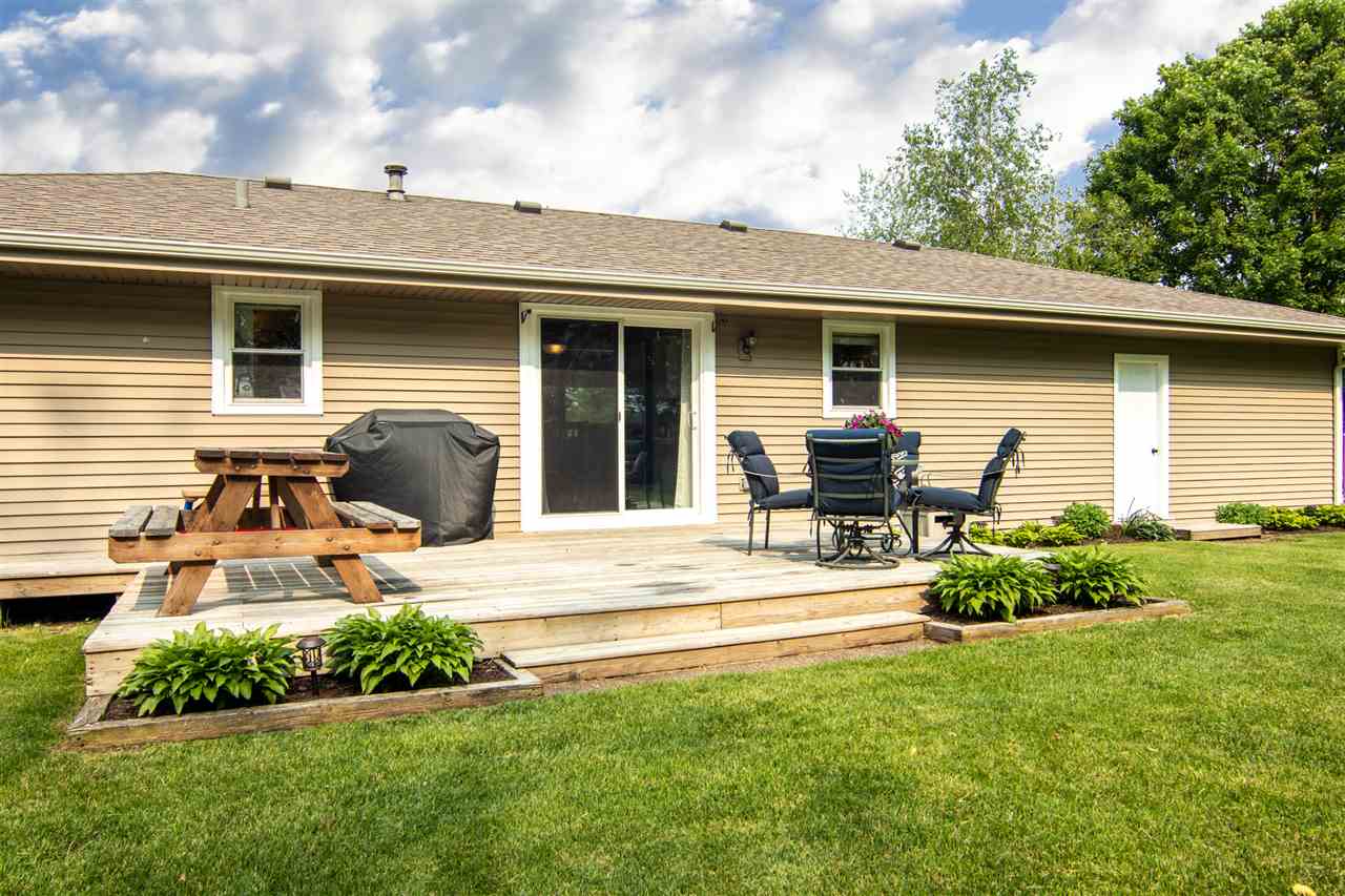 5780 Rural Edge Drive Roscoe, IL 61073 - Photo 23 of 25 a front view of a house with a yard